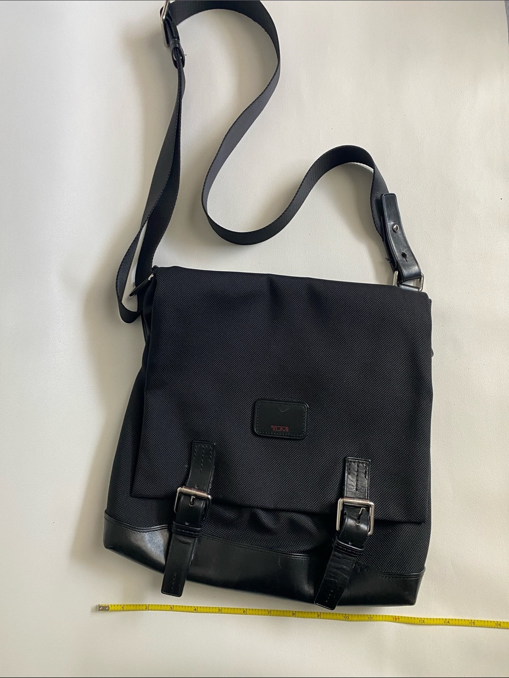 Tumi nylon/leather crossbody  bag fits a 12” laptop pocket front zipper clean
